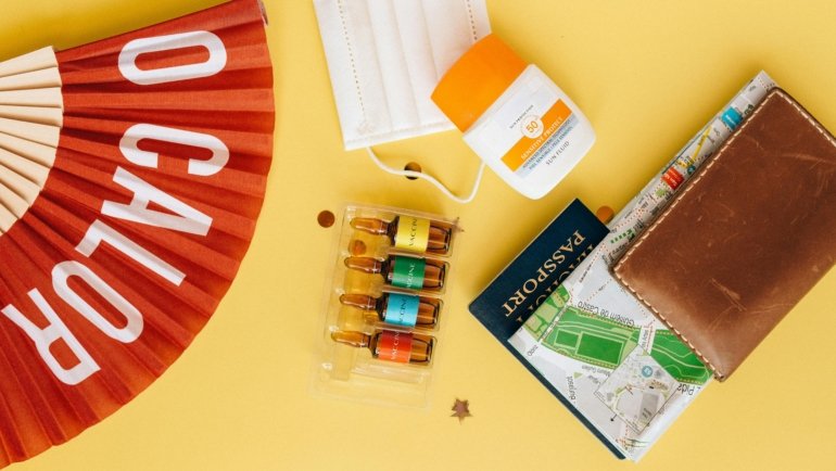 A diverse collection of travel size cleansers and mini skincare essentials, neatly organized in a transparent carry-on bag, highlighting convenience for healthy skin while adhering to airline liquid regulations.