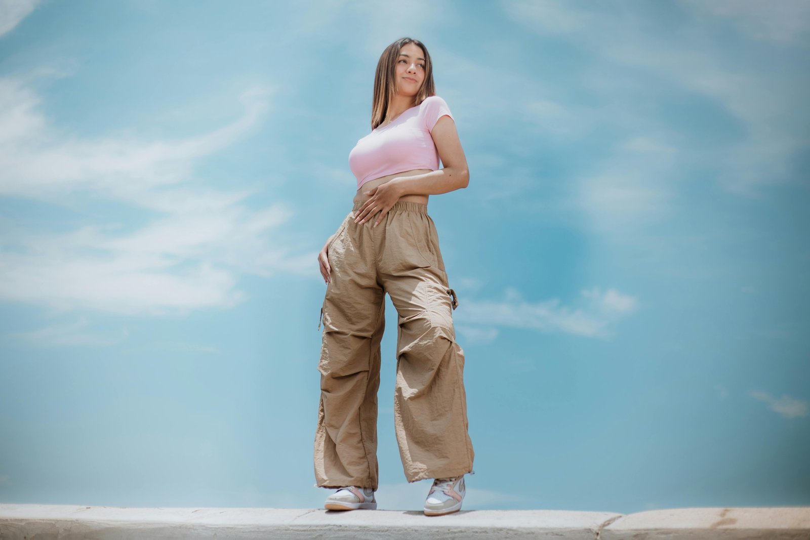 Person wearing modern, comfortable, and versatile travel trousers made from durable, quick-drying stretch fabric, perfect for city exploration and outdoor adventure.