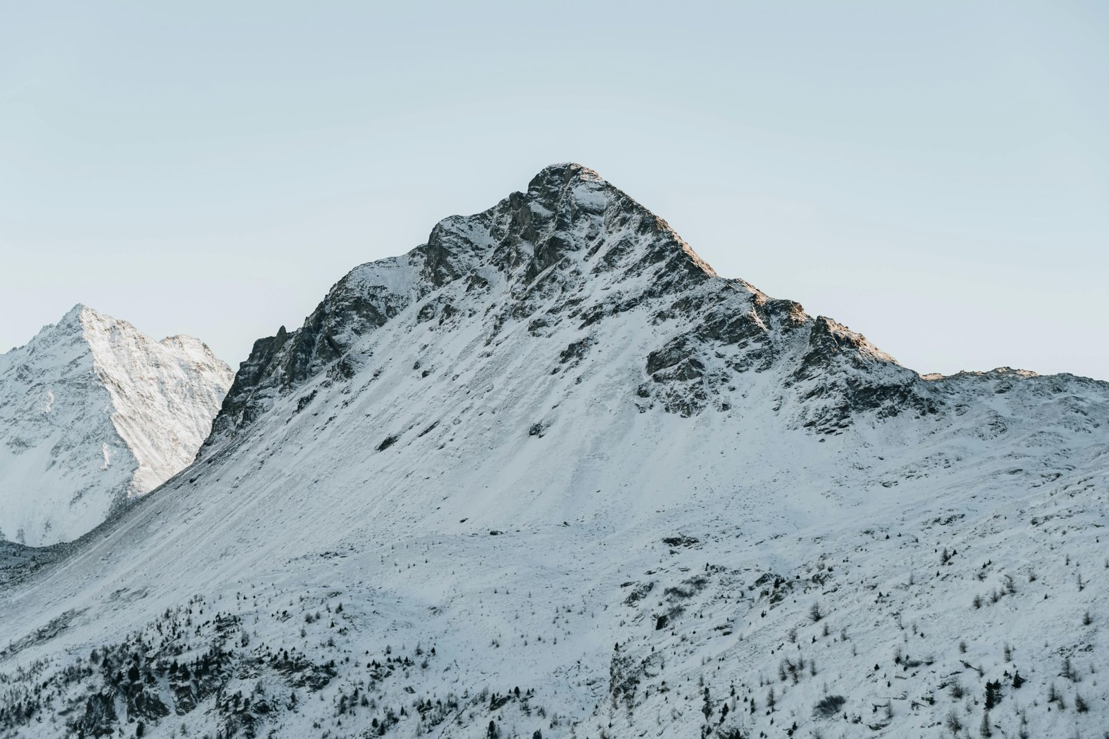 A certified travel EMT in uniform standing confidently in a breathtaking natural landscape, symbolizing exciting global career opportunities for emergency medical technicians combining medical skills with adventure and diverse experiences.