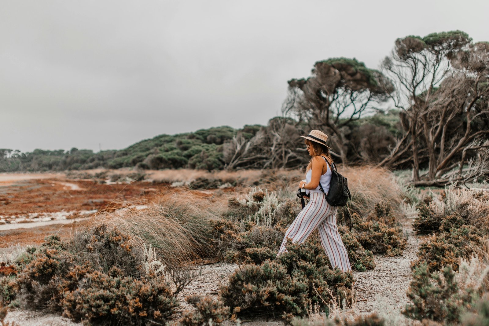 Modern traveler wearing comfortable, versatile, and stylish travel pants, ideal for urban exploration and outdoor adventures.