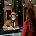 Travelers consulting with staff at a Navajo Travel Center, gathering essential information and maps for exploring the rich cultural heritage and stunning landscapes of the Navajo Nation.