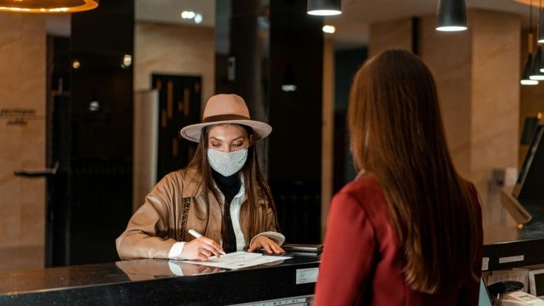 Travelers consulting with staff at a Navajo Travel Center, gathering essential information and maps for exploring the rich cultural heritage and stunning landscapes of the Navajo Nation.