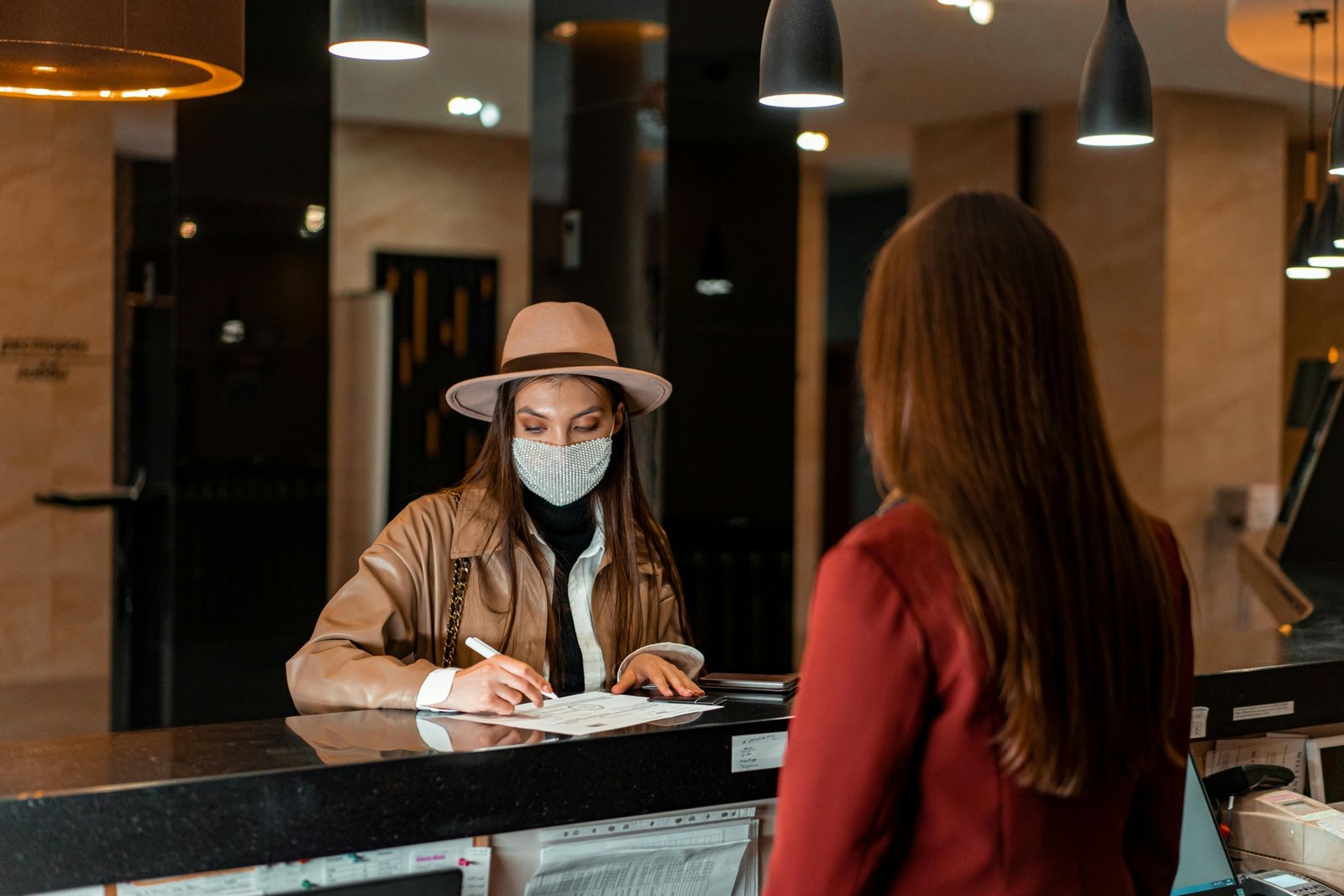 Travelers consulting with staff at a Navajo Travel Center, gathering essential information and maps for exploring the rich cultural heritage and stunning landscapes of the Navajo Nation.