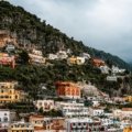 Scenic view of colorful Amalfi Coast villages perched on cliffs above the clear blue Mediterranean Sea
