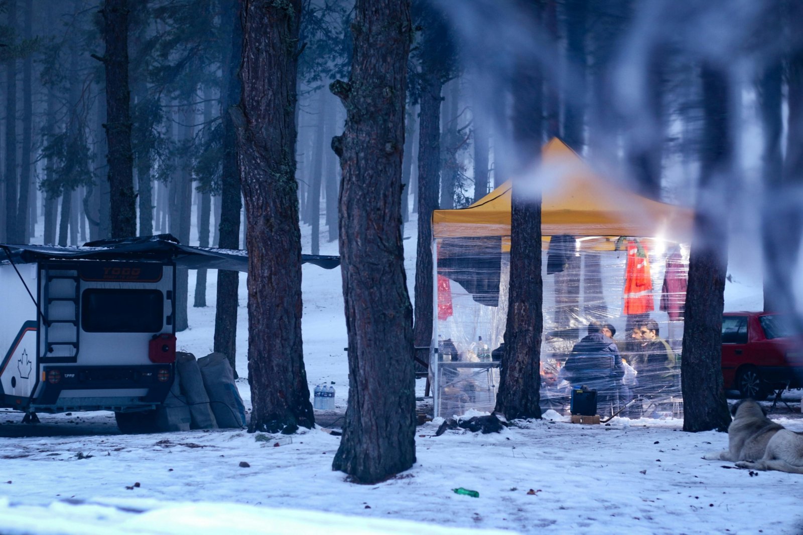 Travel trailer with winter skirting installed protecting undercarriage from cold and snow
