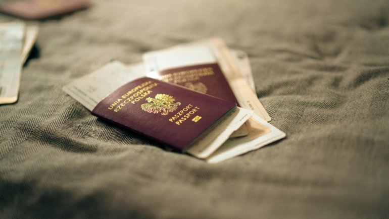 Traveler showing passport at border control for smooth entry to Mexico with felony record