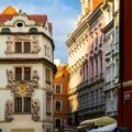 Scenic view of Prague city showcasing its seasonal beauty with historic buildings and atmospheric weather