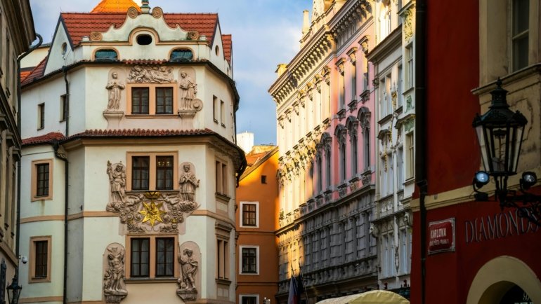 Scenic view of Prague city showcasing its seasonal beauty with historic buildings and atmospheric weather