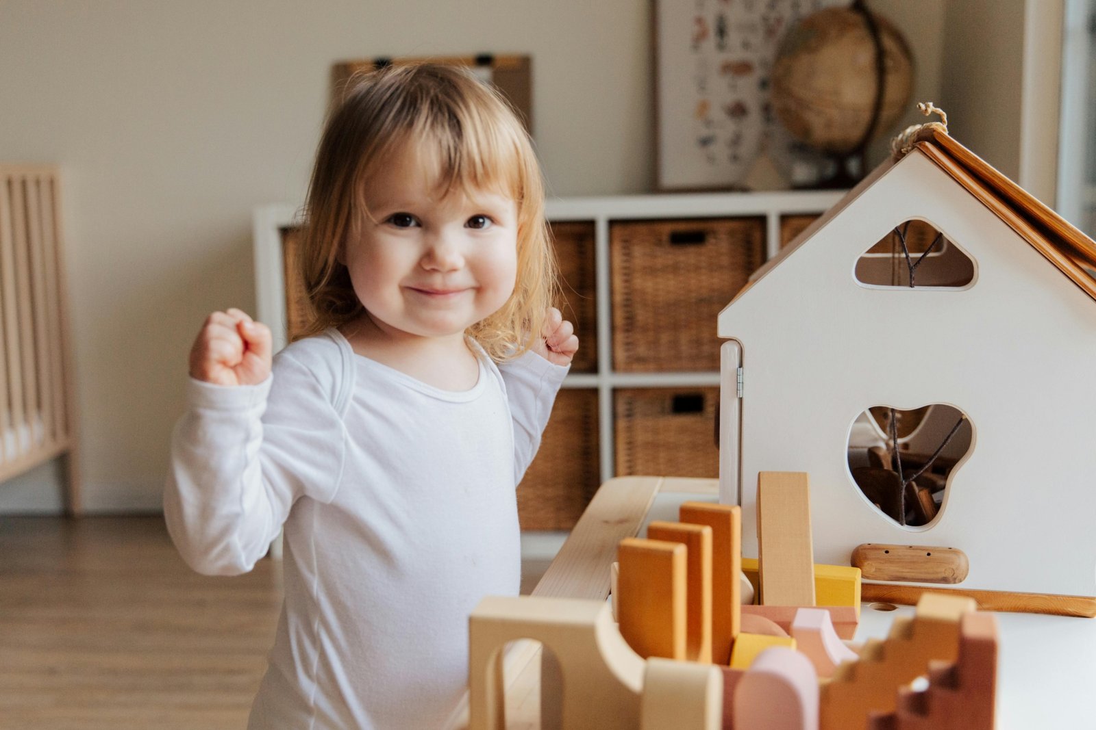 Toddler playing with compact travel toys to stay entertained during a family trip