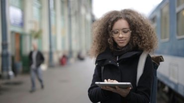 Student with disability confidently using public transportation with travel training materials in Philadelphia