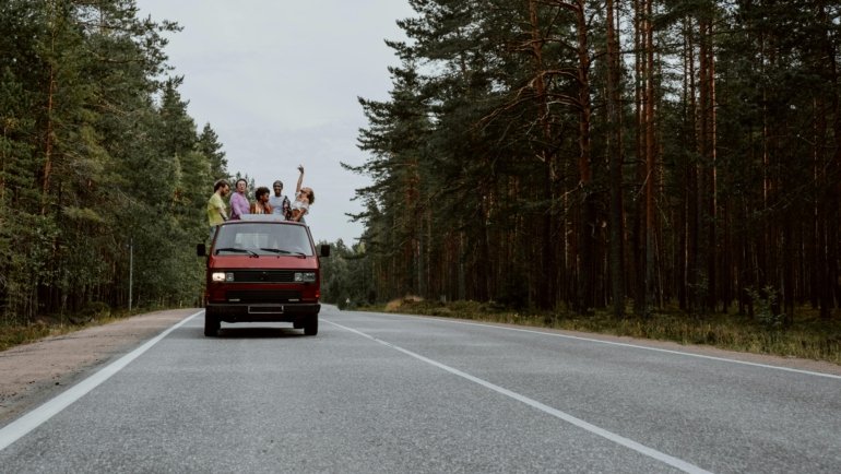 group of adventurous travelers enjoying spontaneous and playful exploration in unique outdoor locations