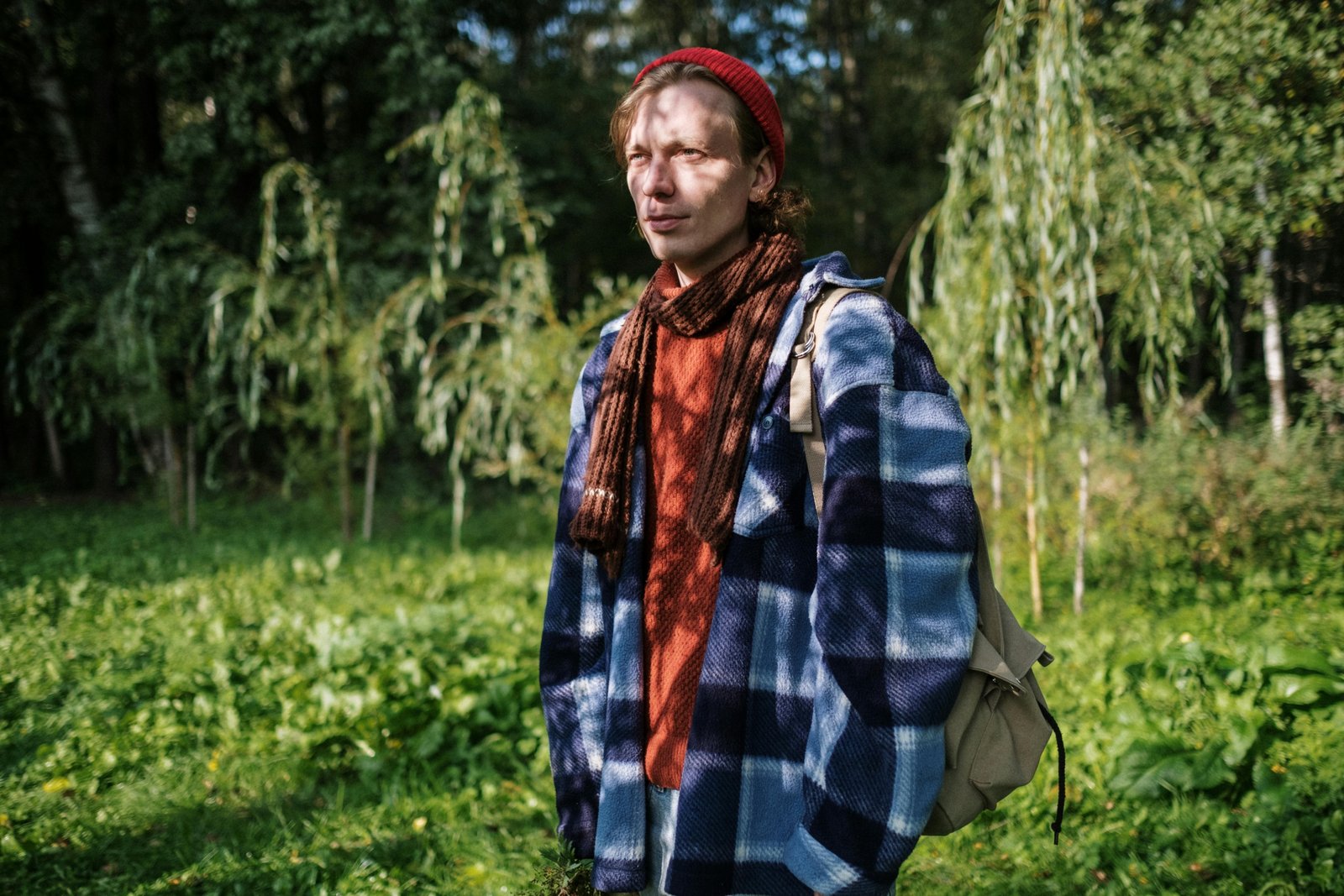 Traveler wearing a cozy and versatile travel wrap scarf outdoors during a cool day