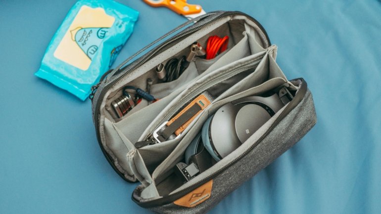 Portable travel bidet packed in a backpack for hygiene and convenience on the go