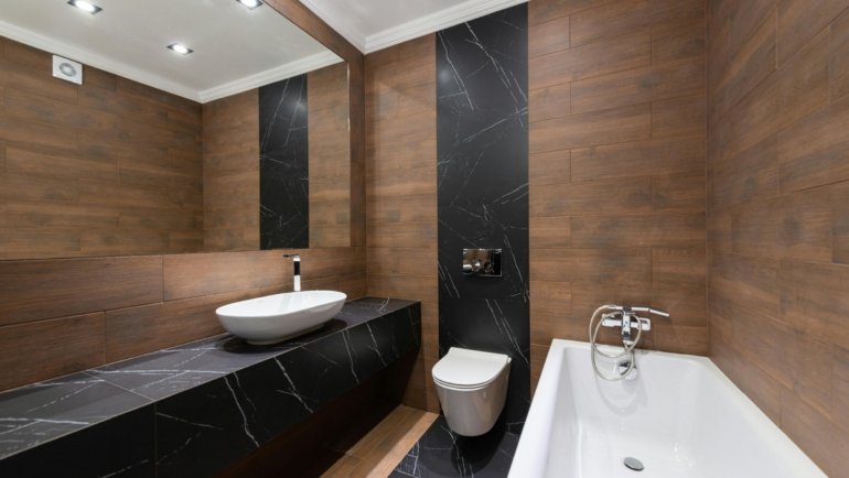 Interior of a travel trailer bathroom with a compact, clean travel trailer toilet for comfortable and hygienic RV living