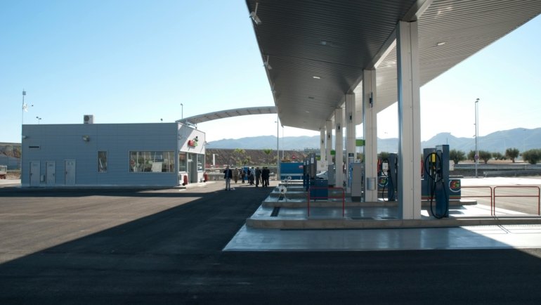 Pilot dealer town pump travel center with fuel pumps, convenience store, and rest area for road travelers