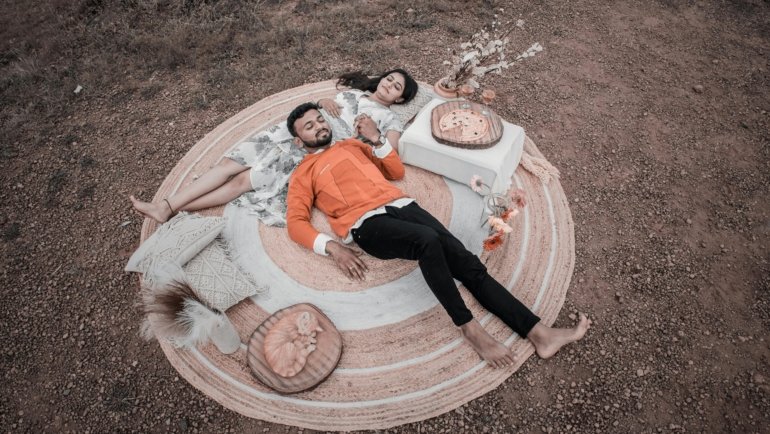 Durable gravel travel blanket spread on rocky surface during outdoor picnic