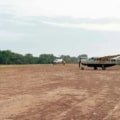 Small charter plane landing on a remote forest airstrip near gorilla trekking park in East Africa