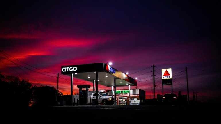 Millers Travel Center showing fuel pumps, truck parking, dining area, and rest facilities for travelers and commercial drivers
