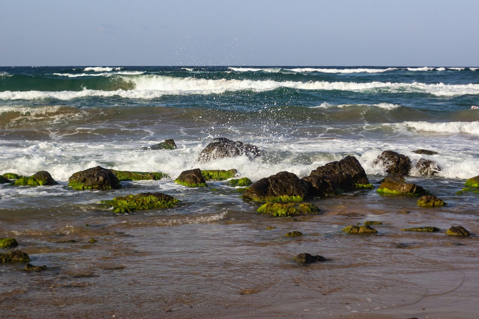 Visualization of sound waves traveling through air influenced by environmental conditions such as temperature gradients and obstacles