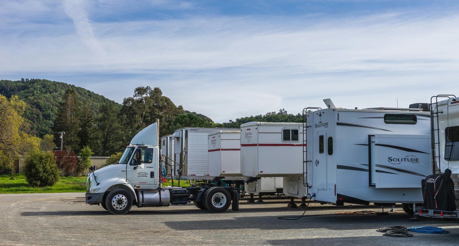 Ozark Travel Center roadside rest stop with fuel pumps, picnic area, and travelers enjoying a break during a scenic road trip