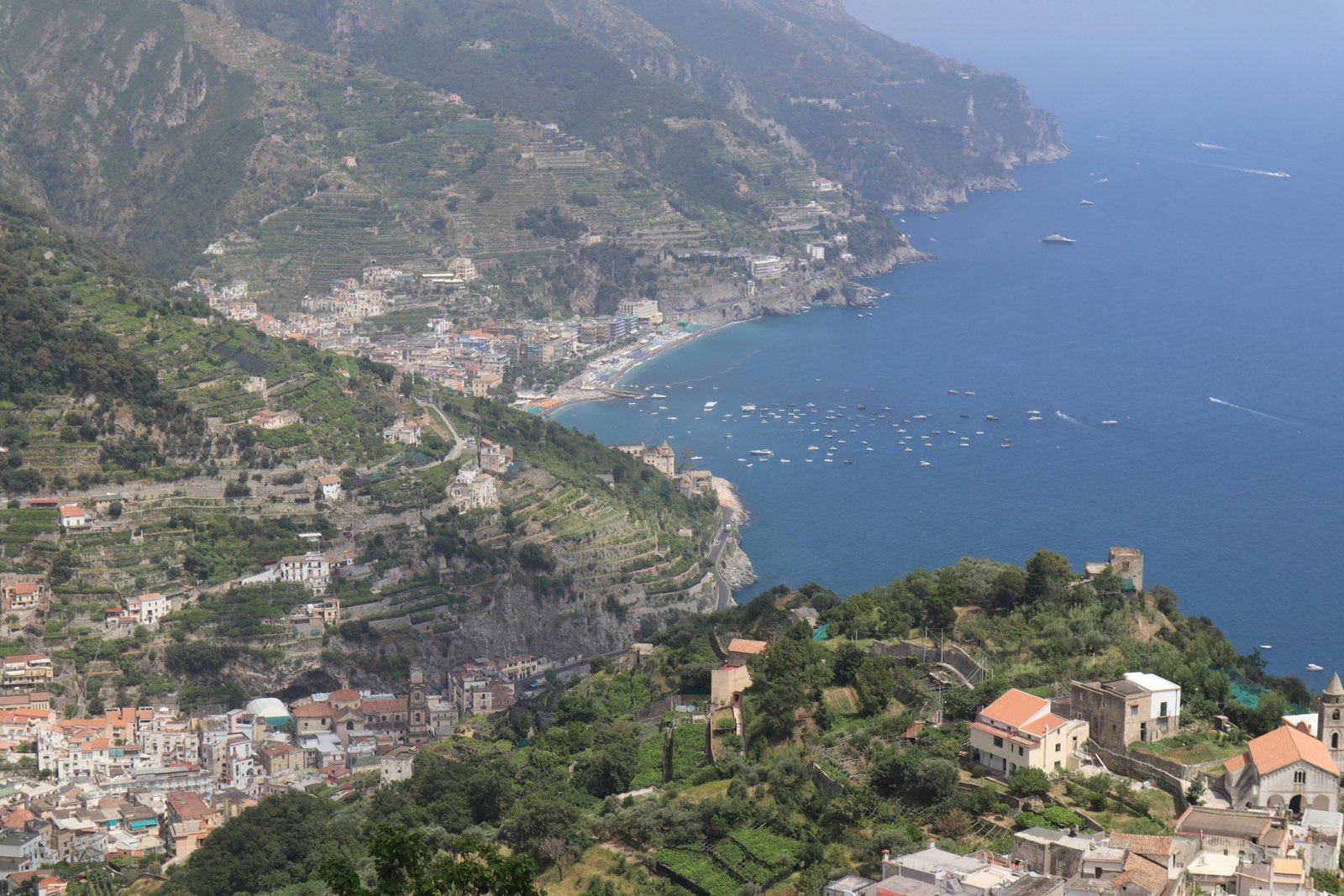 Panoramic view of colorful towns and cliffs along the Amalfi Coast in southern Italy