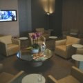 Elite traveler relaxing in a luxury airport lounge with exclusive amenities and priority services