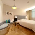 Cozy and affordable budget hotel room with essential amenities and warm lighting