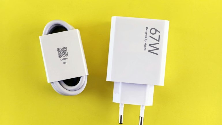 South Africa travel adapter with Type M plug charging smartphone and laptop for international travelers