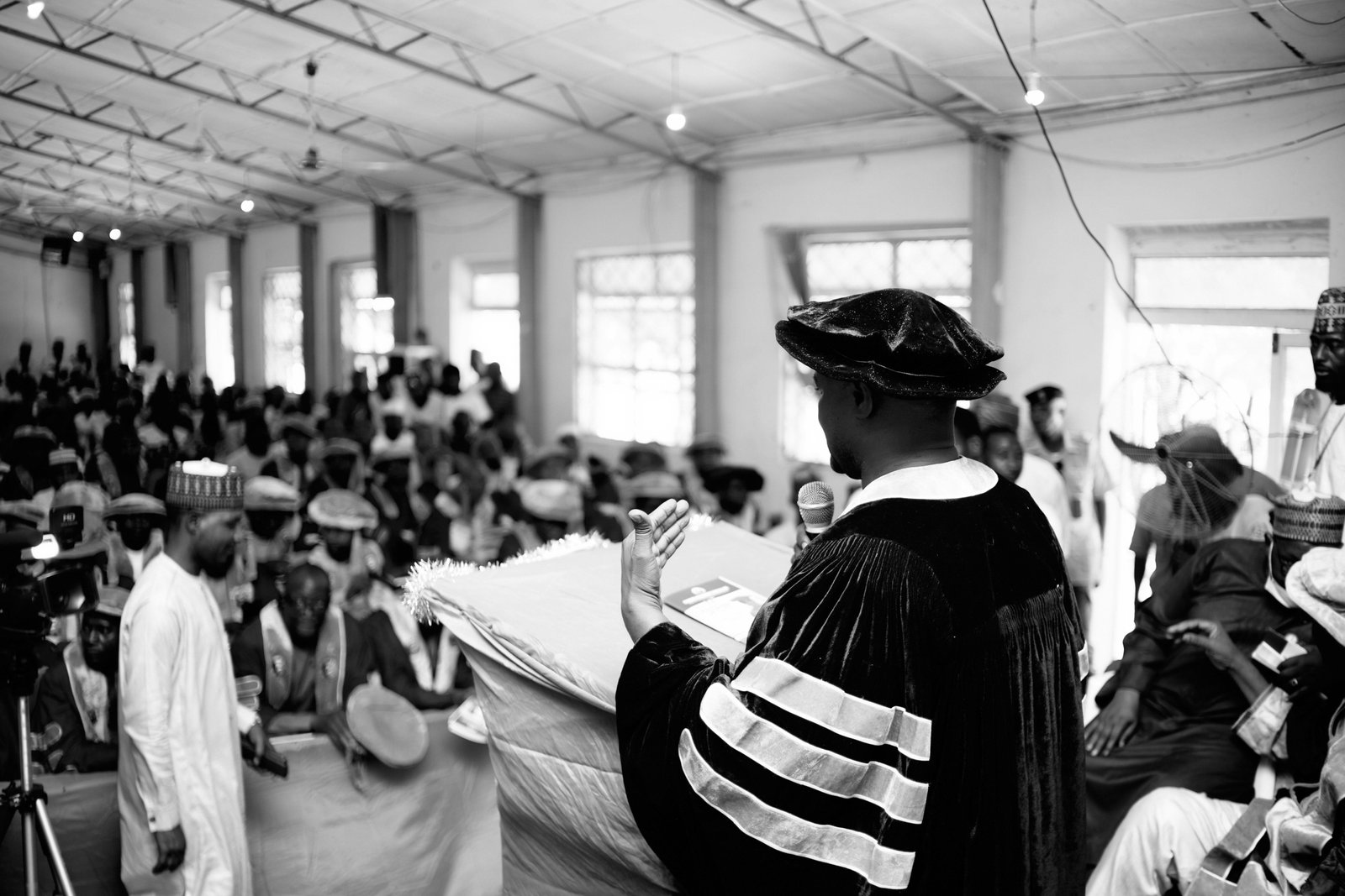 Graduate student preparing for academic conference travel with conference materials and laptop, symbolizing Rackham travel grant support