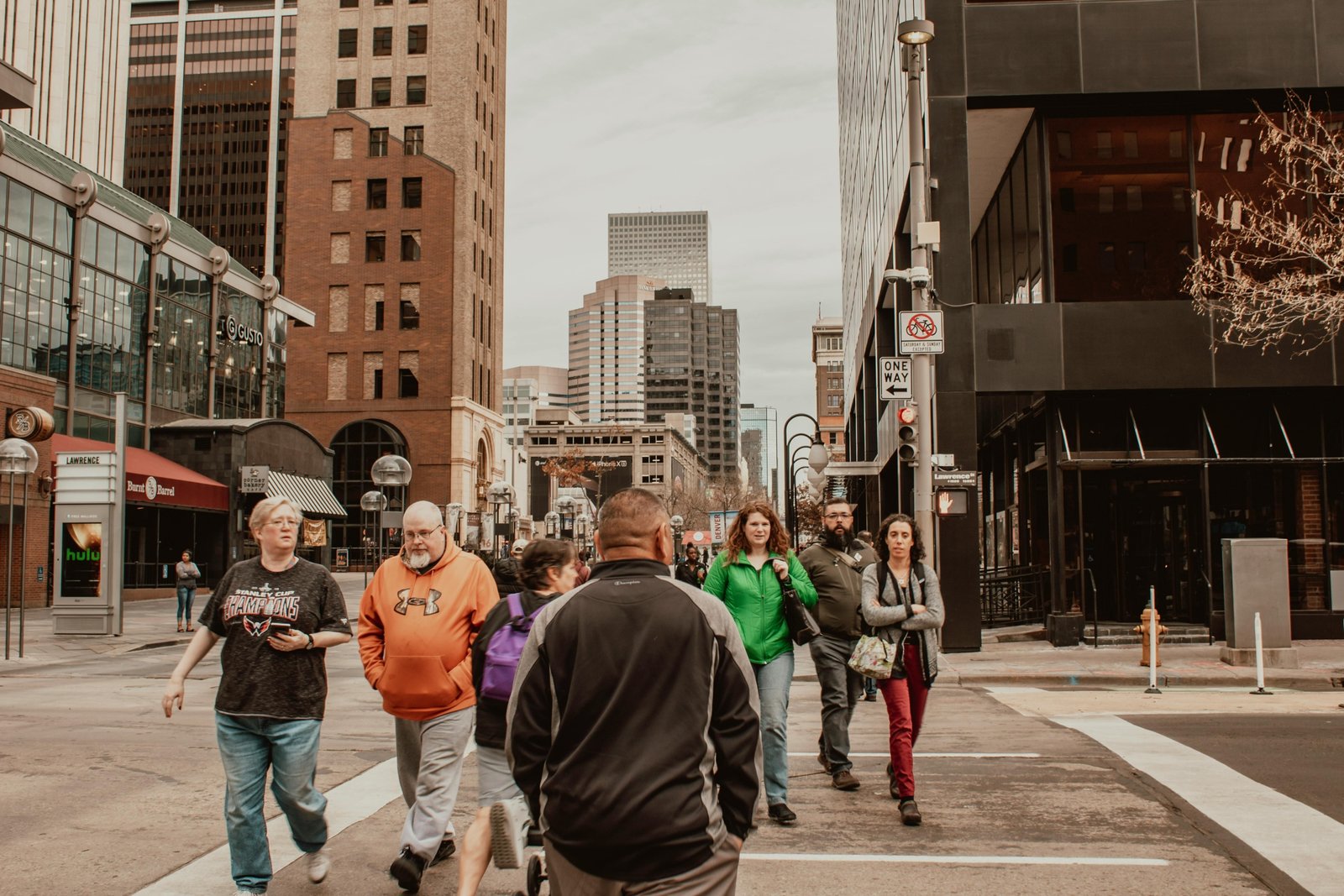 Vibrant downtown city street with pedestrians exploring shops, landmarks, and cultural attractions