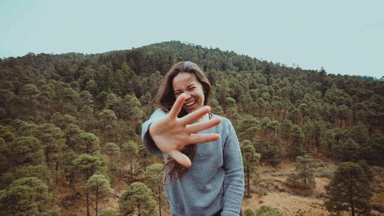 Happy traveler enjoying nature and exploring new destinations during a memorable trip