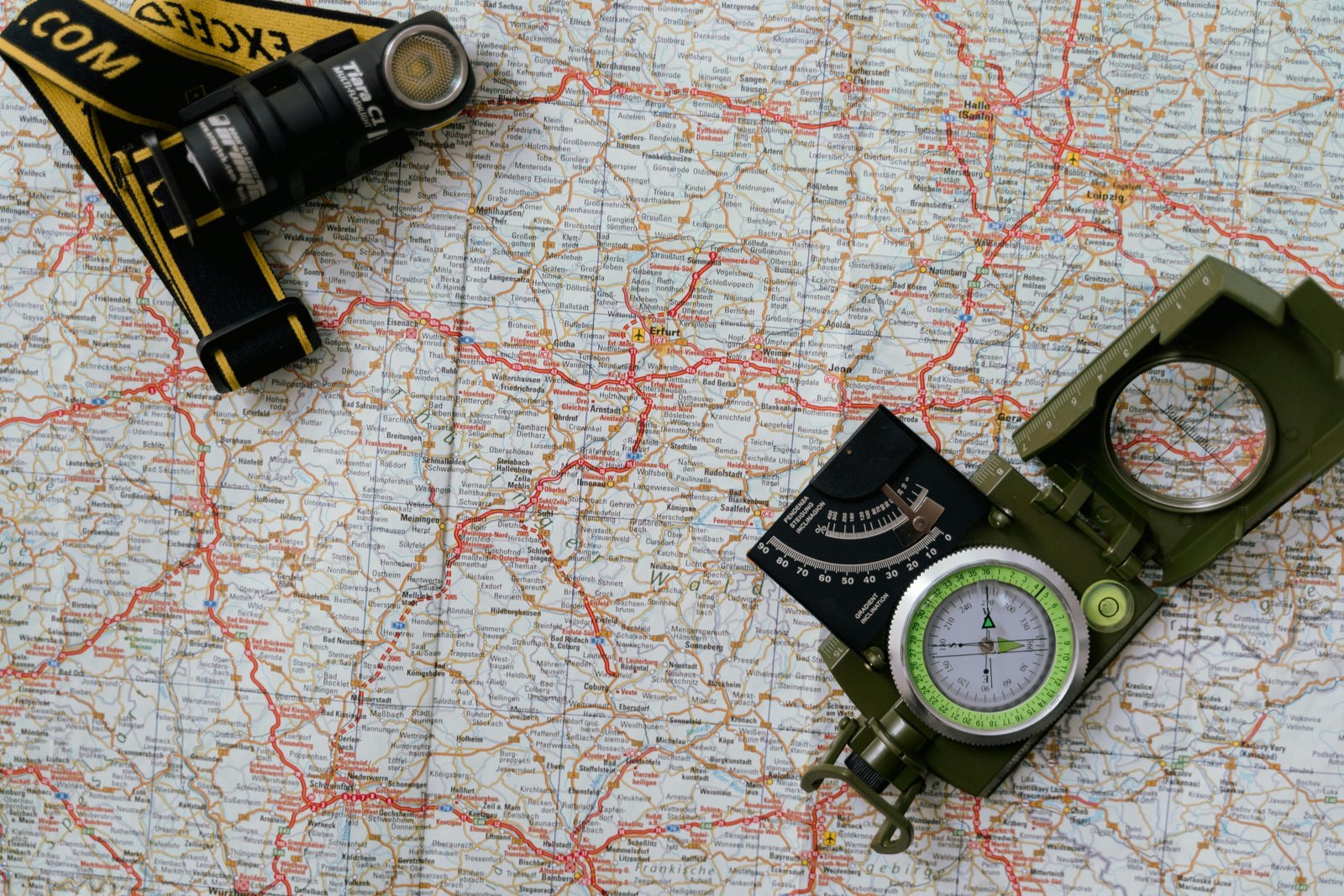 Traveler using Colorado travel guide book and map with Rocky Mountains in the background