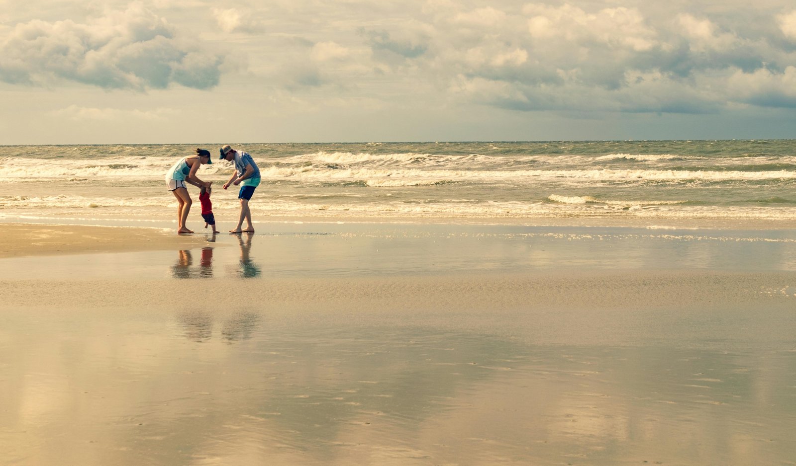Family enjoying a sunny day camping near the beach at a holiday travel park in Emerald Isle North Carolina
