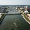 Midwest city skyline with natural scenery, highlighting cultural landmarks and outdoor beauty