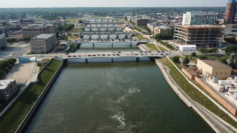 Midwest city skyline with natural scenery, highlighting cultural landmarks and outdoor beauty