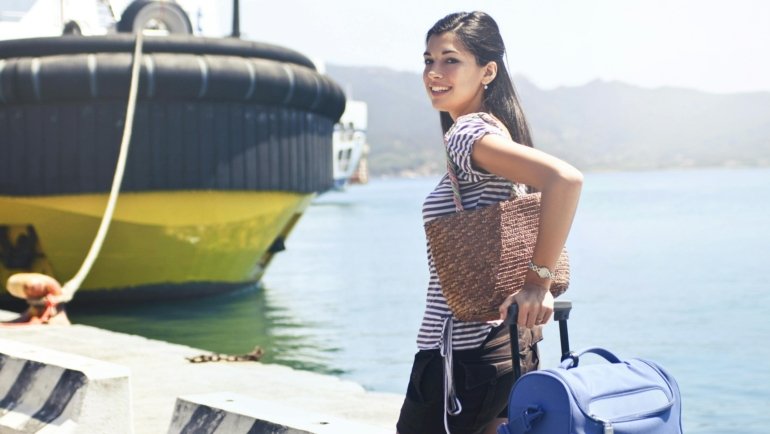 Happy travelers with luggage enjoying their safe and insured trip in Italy