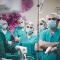 Traveling surgical technologist preparing an operating room in a hospital, showcasing medical expertise and career mobility