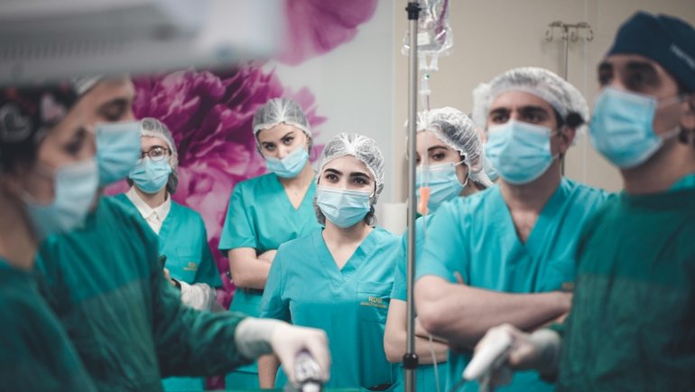 Traveling surgical technologist preparing an operating room in a hospital, showcasing medical expertise and career mobility