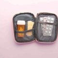 Compact travel size medicine kit with small bottles and blister packs for convenient and safe travel health care