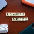 Traveler using smartphone with travel planning apps and digital maps for seamless trip management