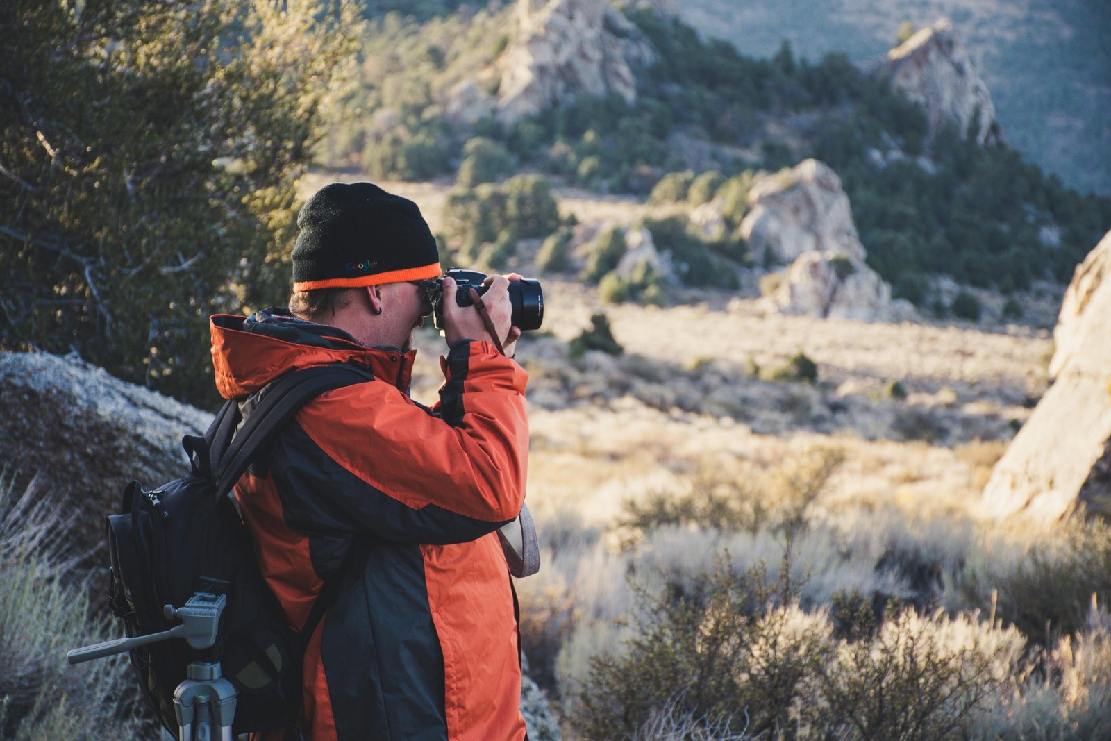 Travel photographer capturing breathtaking landscape during adventure photography assignment