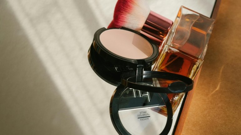 Compact travel perfume bottle with passport and sunglasses symbolizing fresh and confident travel experience