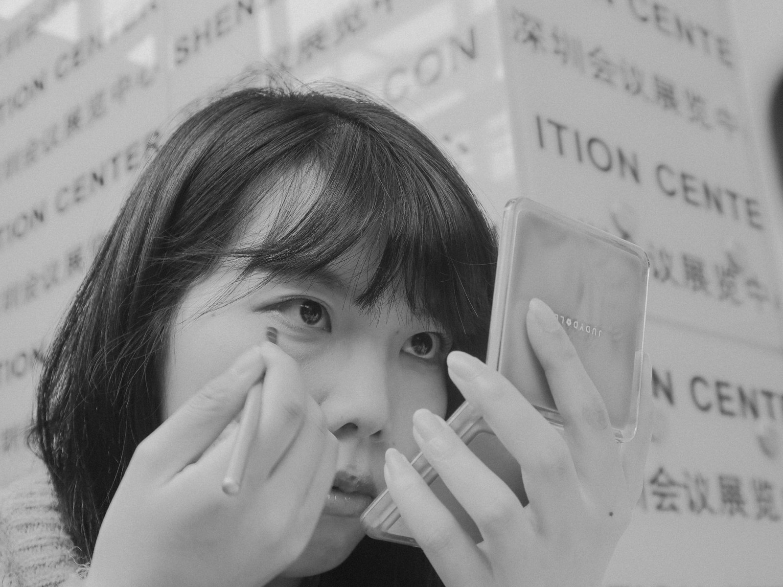 Portable travel magnification mirror with LED light used for detailed makeup application on the go