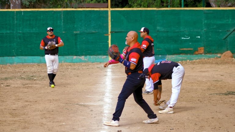 Youth baseball traveling team celebrating together before tournament game, showcasing teamwork and competitive spirit