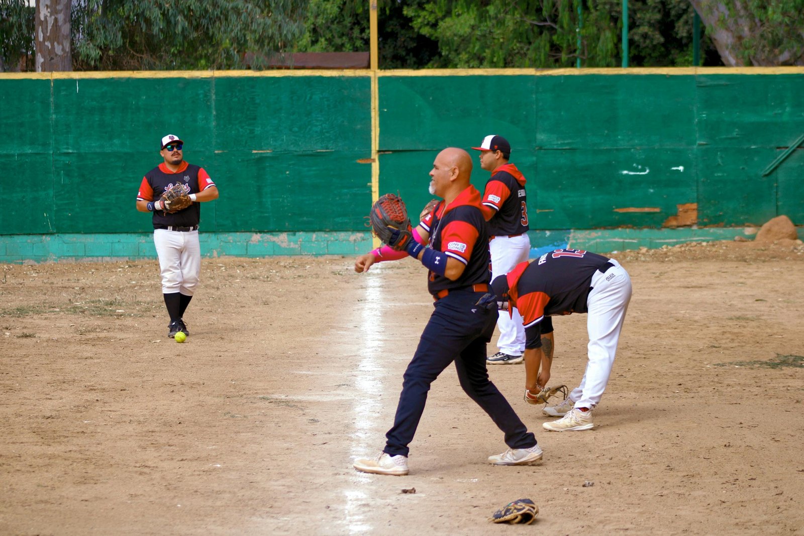 Youth baseball traveling team celebrating together before tournament game, showcasing teamwork and competitive spirit