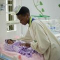 Neonatal travel nurse caring for newborn infant in Charlotte NICU hospital