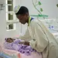 Neonatal travel nurse caring for newborn infant in Charlotte NICU hospital