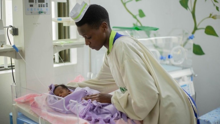 Neonatal travel nurse caring for newborn infant in Charlotte NICU hospital