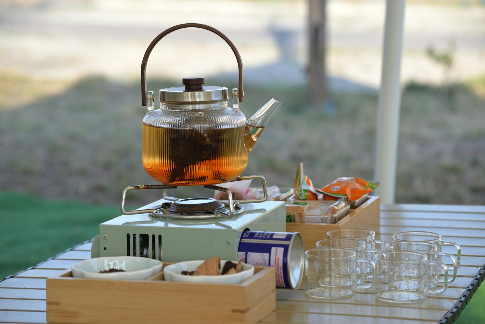 Traveler enjoying portable travel tea with compact tea kit outdoors