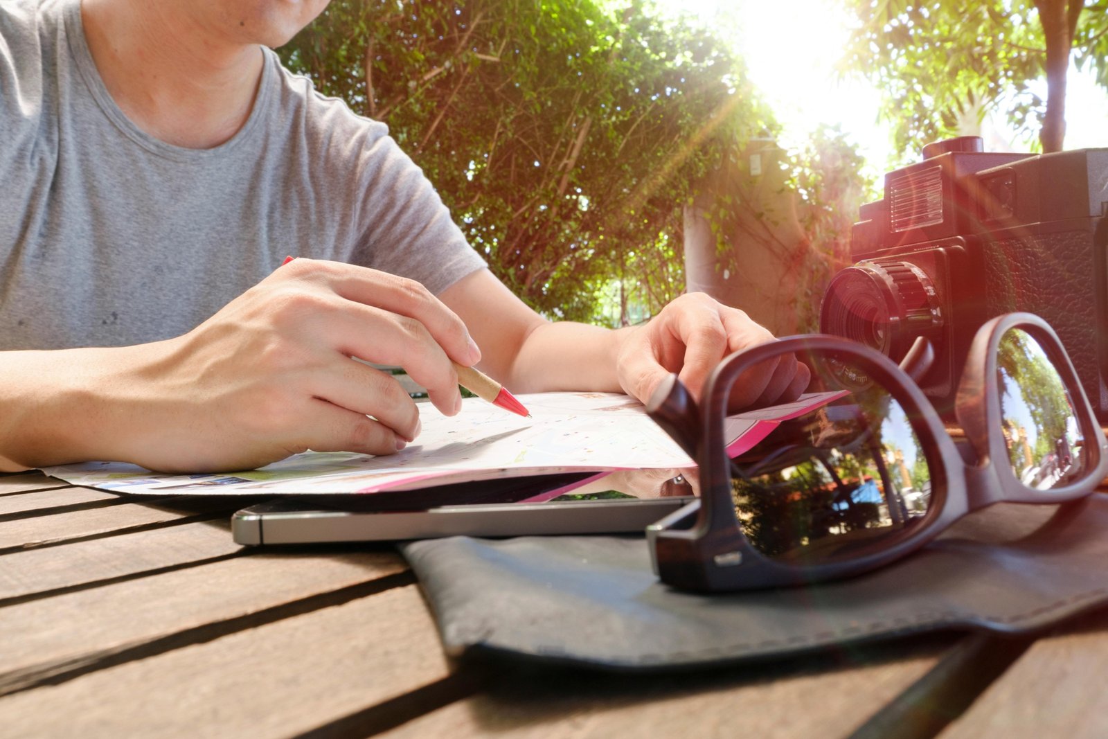 Traveler taking natural supplement pills to prevent traveler's diarrhea while on an international trip